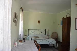 Postel nebo postele na pokoji v ubytování B&B La Terrazza Del Subasio