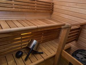 an inside of a sauna with a speaker in it at Holiday Home Tahko spa red - golf apartment by Interhome in Tahkovuori +3 photos