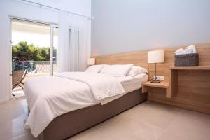 Postel nebo postele na pokoji v ubytování Villa Petra