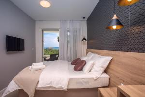 Postel nebo postele na pokoji v ubytování Villa Petra