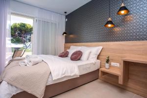 Postel nebo postele na pokoji v ubytování Villa Petra