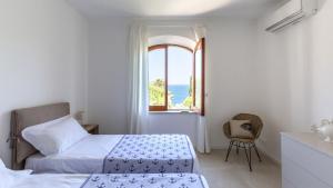 La Matrangela Charme Apartments客房内的一张或多张床位