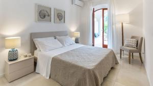 La Matrangela Charme Apartments客房内的一张或多张床位