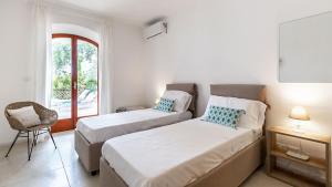 La Matrangela Charme Apartments客房内的一张或多张床位