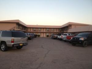 a large parking lot in front of a building at Economy Inn Alamogordo in Alamogordo +13 photos