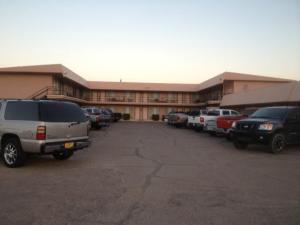 a large parking lot in front of a building at Economy Inn Alamogordo in Alamogordo