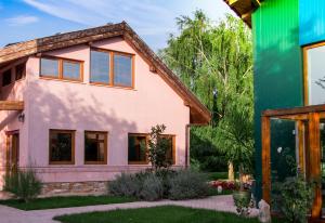 a house renovation with a pink at Daiconi Boutique House in Miniş