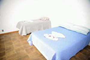 เตียงในห้องที่ Residencial Aconchego +9 ภาพ