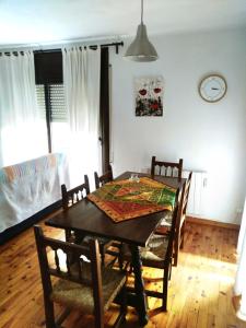 a dining room with a table and chairs at Apartament a Alp de Cerdanya in Alp +5 photos