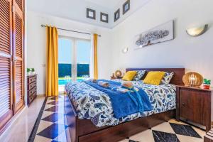 Postel nebo postele na pokoji v ubytování Villa Silvana