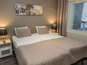 Lova arba lovos apgyvendinimo įstaigoje Holiday Home Tahko spa red - golf apartment by Interhome