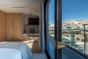 Posteľ alebo postele v izbe v ubytovaní Hub Suites, Luxury living in Athens