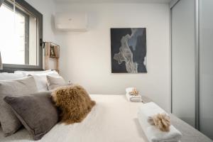מיטה או מיטות בחדר ב-Savyoney Ramat Sharet - Isrentals