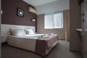 Postel nebo postele na pokoji v ubytování Hotel Eskada Beach