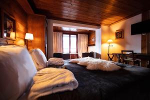 
A bed or beds in a room at La Savoyarde
