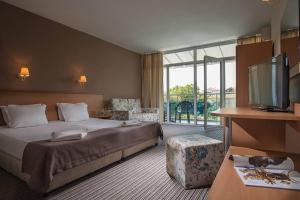 Postel nebo postele na pokoji v ubytování Hotel Eskada Beach