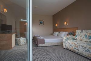 Postel nebo postele na pokoji v ubytování Hotel Eskada Beach