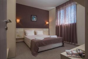 Postel nebo postele na pokoji v ubytování Hotel Eskada Beach