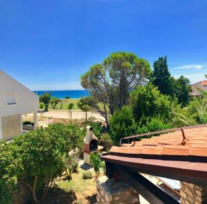 a view of the ocean from the roof of a house at Studio Apartment Branko in Novalja