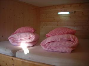 Letto o letti in una camera di Skihütte Zams