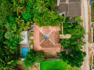 an overhead view of a garden with a clock on it at Thambu Illam in Jaffna