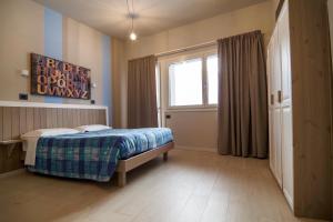 Posteľ alebo postele v izbe v ubytovaní Hotel Laghetto