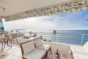 a living room with a view of the ocean at Mer du Sud 4 YourHostHelper in Cannes