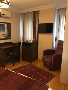 TV a/nebo společenská místnost v ubytování Berce Apartments