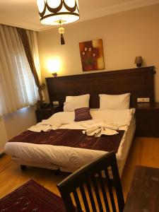 Postel nebo postele na pokoji v ubytování Berce Apartments