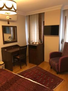 TV a/nebo společenská místnost v ubytování Berce Apartments