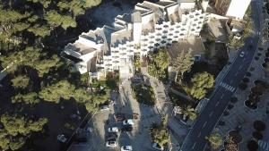 an overhead view of a city with a parking lot at HOTEL CHELIA in Batna