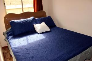 En eller flere senge i et værelse på Cabanas Via Nautica