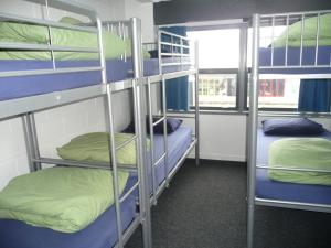 Postel nebo postele na pokoji v ubytování Mount Backpackers