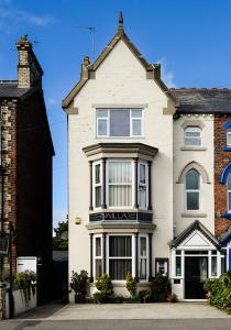 a large white house with a large window at The Villa Bridlington in Bridlington