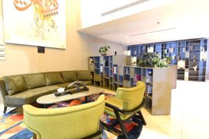 a living room with a couch and a table and chairs at فندق برام - Bram Hotel in Jeddah +63 photos