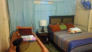 Postel nebo postele na pokoji v ubytování El Conde de Villa Rosa