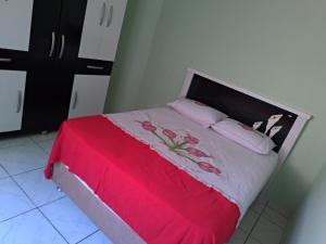 מיטה או מיטות בחדר ב-Kitnet Coroa Vermelha