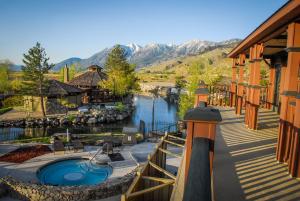 a resort with a swimming pool next to a river at Holiday Inn Club Vacations - David Walley's Resort, an IHG Hotel in Genoa