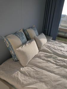 Ein Bett oder Betten in einem Zimmer der Unterkunft Duinenzicht