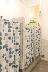 a group of shower curtains in a bathroom at 1900 Hostel in Lima