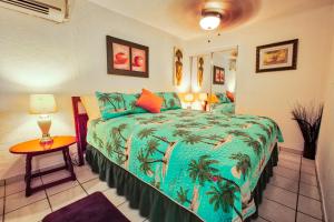 Letto o letti in una camera di Coconut Palms Inn
