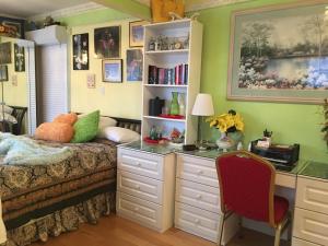 a bedroom with a bed and a desk and a desk at Diana's Luxury Bed and Breakfast in Vancouver