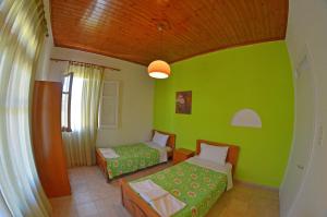 Postel nebo postele na pokoji v ubytování Othonas Apartments