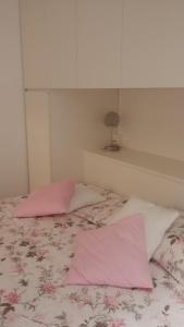 En eller flere senger på et rom på Appartamento Carboncina