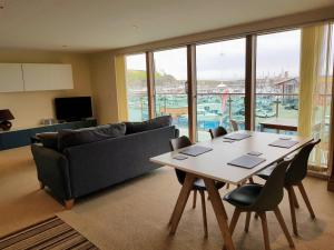 a living room with a table and a couch at Harbourside Apartment in Whitehaven