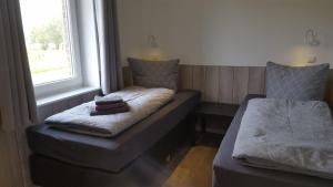 Postel nebo postele na pokoji v ubytování Emsgold