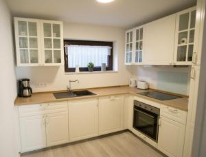 Kuchyň nebo kuchyňský kout v ubytování Ferienwohnung Charlotte