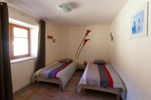 Postel nebo postele na pokoji v ubytování Gîte La Grange