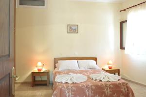A bed or beds in a room at BBB - Barbati Blick Bungalows