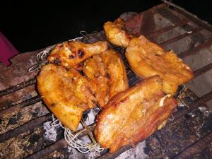 a group of fried food on a grill at Villa Encantador Resort in San Vicente